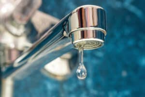 water drips from a leaky faucet